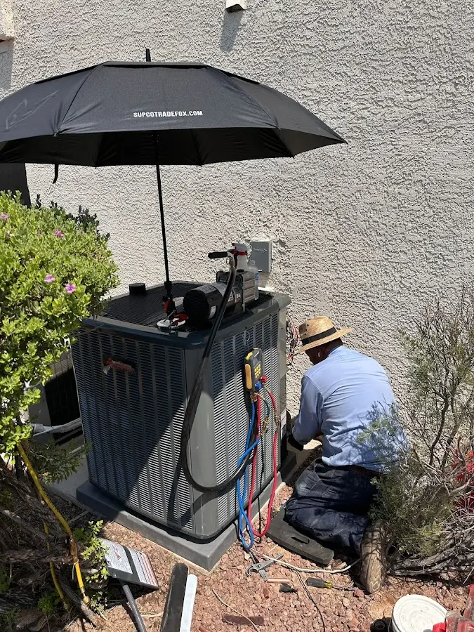 HVAC technician performing outdoor AC maintenance in Washington